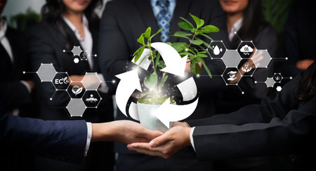 Business partnership nurturing or growing plant together with recycle icon symbolize ESG sustainable environment protection with eco recycling technology and recyclable resource management. Relianceの写真素材