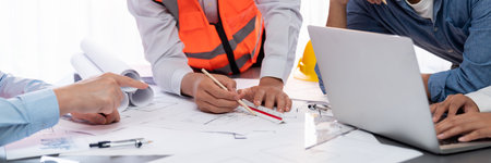Architect or engineer working on building blueprint, contractor designing and drawing blueprint...