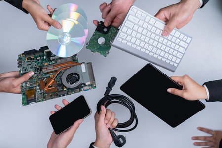 Top view hand holding electronic waste on isolated background. Eco-business recycle waste policy in corporate responsibility. Reuse, reduce and recycle for sustainability environment. Quaintの写真素材