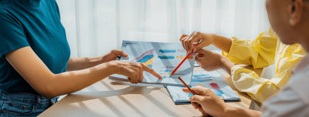 Startup company employee working together, analyzing BI dashboard paper on financial data report and planning strategic marketing for business success in panorama banner. Synergicの写真素材