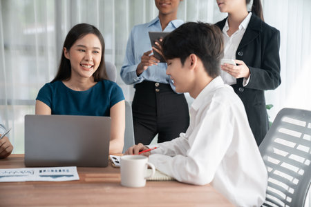 Multiracial analyst team use BI dashboard data to analyze financial report on meeting table. Group of diverse business people utilize data analysis by FIntech for success business marketing. Concordの写真素材