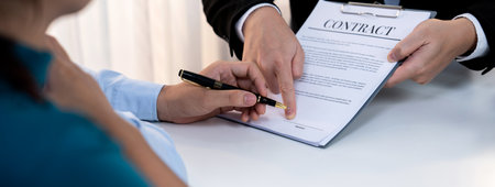 Loving couple seek legal consultation and assistance from law firm to discuss marriage law, proposal weddings and spousal support. Lawyer providing advice on marriage certification. Panorama Rigidの写真素材