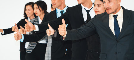 Successful business people standing together showing strong relationship of worker community. A team...