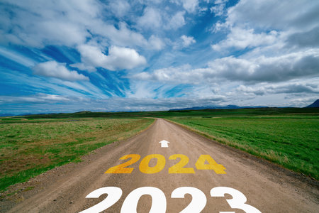 2024 New Year road trip travel and future vision concept . Nature landscape with highway road leading forward to happy new year celebration in the beginning of 2024 for bliss and successful start .の写真素材