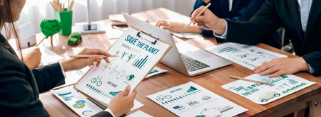 Eco business company meeting with group of business people planning strategy and discuss marketing of eco-friendly and renewable clean energy products. Green business company concept. Trailblazingの写真素材