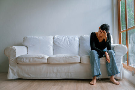 Depressed young Asian woman with mental health problem in mind need uttermost treatment from overthinking fatigue, disruptive thought, dissocial, anxiety and other mental health disorders .の写真素材