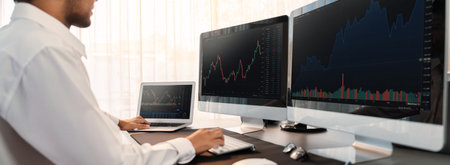 Stock trading investor monitoring dynamic financial data graph for profitable trade. Businessman or...