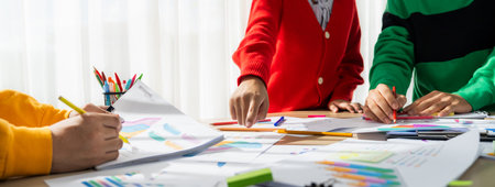 Startup company employee working together, analyzing BI dashboard paper on financial data report and...