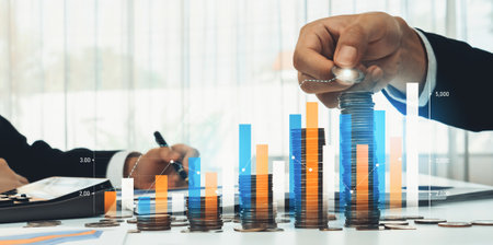 Coin stack with digital graphic indicator symbolizing business investment and economic growth....