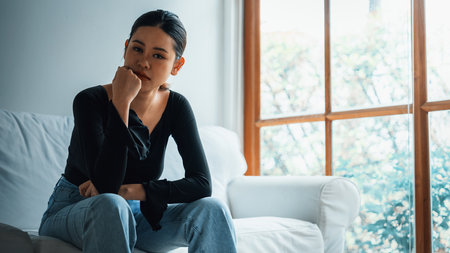 Depressed young Asian woman with mental health problem in mind need uttermost treatment from overthinking fatigue, disruptive thought, dissocial, anxiety and other mental health disorders .の写真素材