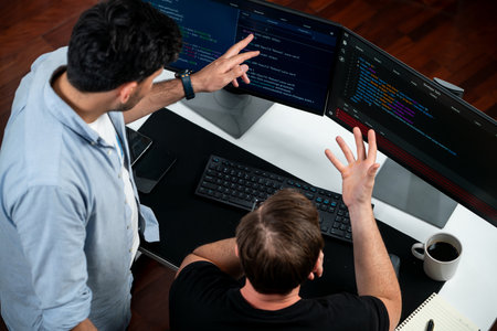 IT developers discussing online software development information on pc screen, creating program...