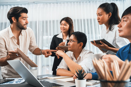 Group of diverse office worker employee working together on strategic business marketing planning in corporate office room. Positive teamwork in business workplace concept. Prudentの写真素材