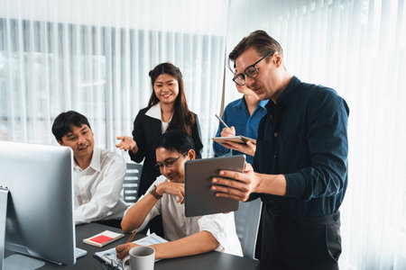 Group of diverse office worker employee working together on strategic business marketing planning in corporate office room. Positive teamwork in business workplace concept. Prudentの写真素材