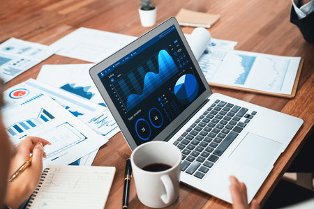 Financial data analysis dashboard by Fintech BI or business intelligence display on laptop screen to in-depth financial data analysis by business people working on business marketing. Habilimentの写真素材