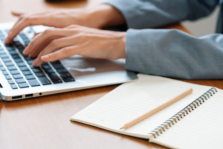 Businesswoman taking note while working on business on workspace table. Young college student study...
