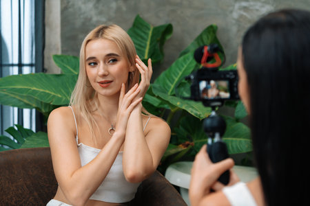 Two beautiful content creator making natural beauty and cosmetic tutorial on green plant leave garden video. Beauty blogger showing how to beauty care to social medial audience by selfie stick. Blitheの写真素材