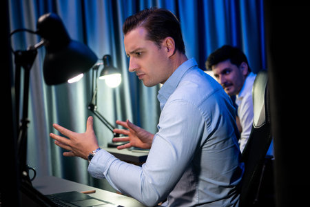 Stressful businessman waiting email sending back for deadline project overwork load at night time,...