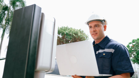 Qualified technician working on home EV charging station installation, making troubleshooting and...