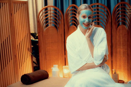 Serene ambiance of spa salon, woman customer indulges in rejuvenating with luxurious face cream...