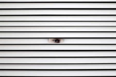 Scary eye peek out of strip lines abstract concept of unhappy vision minimal comelinessの素材