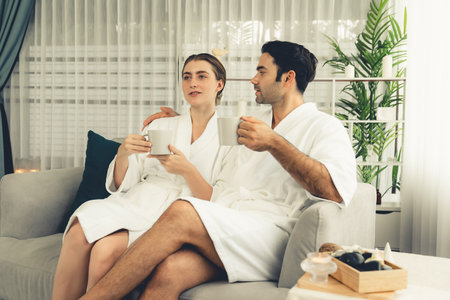 Beauty or body treatment spa salon vacation lifestyle concept with couple wearing bathrobe relaxing...