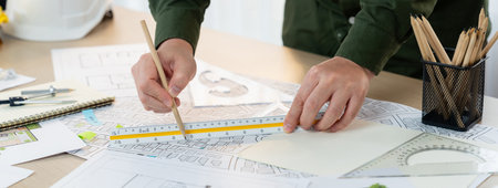 Professional engineer measuring the blueprint. Professional engineer working architectural project...