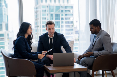 Young smart businesswoman showing data analysis to diverse investor by using tablet. Multicultural...