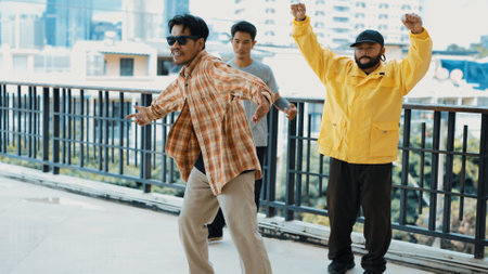 Hipster perform break dancing while partner dancing together at corridor, modern mall. Hip-hop music...