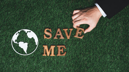 Eco awareness campaign for Earth day concept showcase message arranged in Save Earth on biophilic green background. Environmental social governance concept idea for sustainable and greener future.Gyreの写真素材