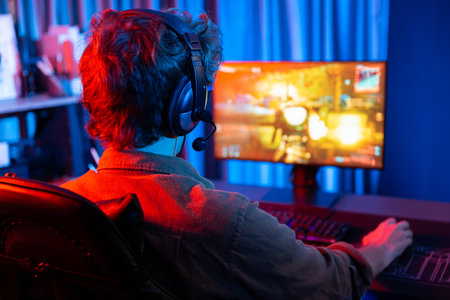Host channel of young gaming streamer, team gamer playing battle game shooting with multiplayer at...
