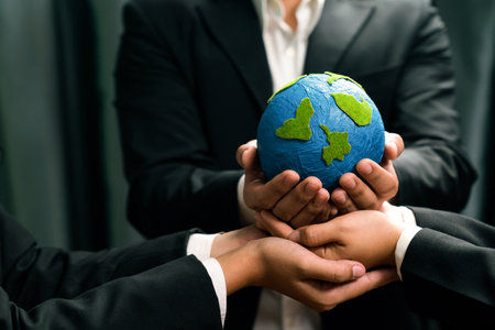 Top view business people holding Earth together in synergy as team building to utilize eco regulation for environmental protection by reducing CO2 emission to save Earth. Quaintの写真素材