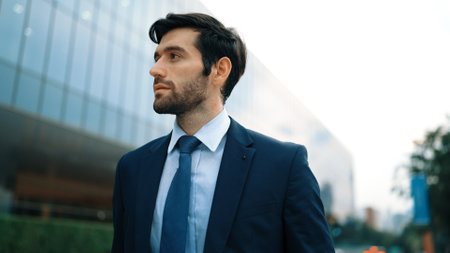 Closeup portrait of professional business man standing at camera at city view. Skilled project...