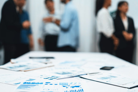 Business intelligence and analyzed financial data visualized on papers with blur background of...