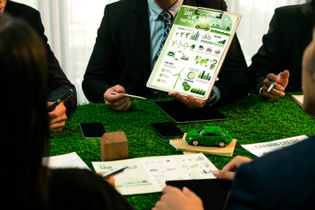 Diverse group of business people planning for alternative energy utilization for greener sustainable Earth by reducing CO2 emission and carbon credit with renewable clean energy technology. Quaintの写真素材