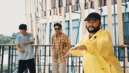 Hipster perform break dancing while partner dancing together at corridor, modern mall. Hip-hop music dancer practice footstep and move to music. Outdoor sport 2024. Active, energetic dance. Endeavor.の写真素材