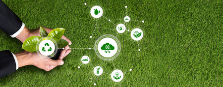 Businessman nurturing and holding plant with recycle symbol. Business commitment and investing in...