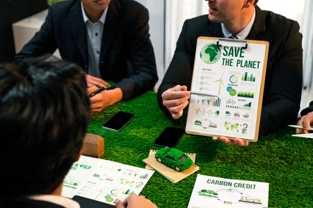 Diverse group of business people planning business marketing with environmental responsibility for greener ecology. Productive teamwork contribute natural preservation and sustainable future. Quaintの写真素材