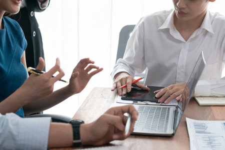 Diverse business people work together, discuss in corporate office. Professional teamwork discussing...