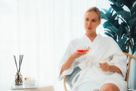 Beauty or body treatment spa salon vacation lifestyle concept with woman wearing bathrobe relaxing...