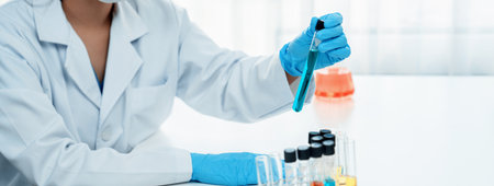 Laboratory researcher develop new medicine or cure using colorful chemical liquid in lab tube. Technological advance of healthcare with scientific expertise with laboratory equipment. Panorama Rigidの写真素材