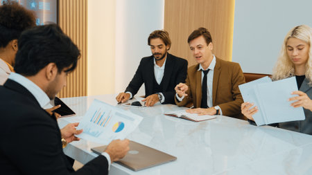 Diverse office worker employee working and brainstorm on strategic business marketing planning. Teamwork and positive attitude create productive and supportive in ornamented business office workplace.の写真素材