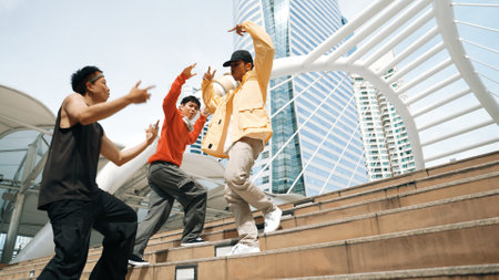 Happy hipster group walking up stair while perform street dance. Attractive asian dancer dancing...