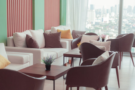 Empty stylish and modern office interior with skyscrapers view decorated with table, chair, botany decoration, elegant accessory. Living room. Modern interior. Creative design. Day light. Ornamented.の写真素材