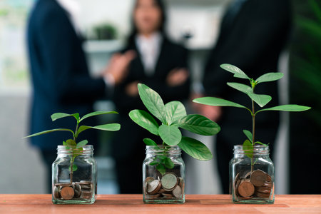 Organic money growth investment concept shown by money savings in glass jar. Financial investments...