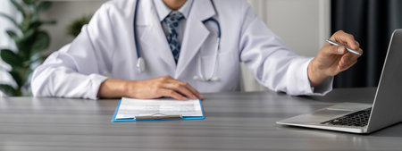 Doctor carefully review detailed medical report with laptop and diagnosing illness for effective healthcare treatment plan for patient in doctor office. Professional medical evaluation. Neotericの写真素材
