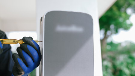 Qualified technician install home EV charging station, providing maintenance service for electric...