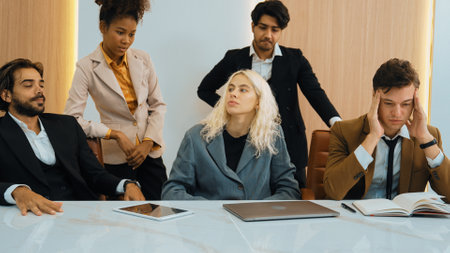 Diverse office worker employee with colleges feels tired and frustrated due to difficult problem...