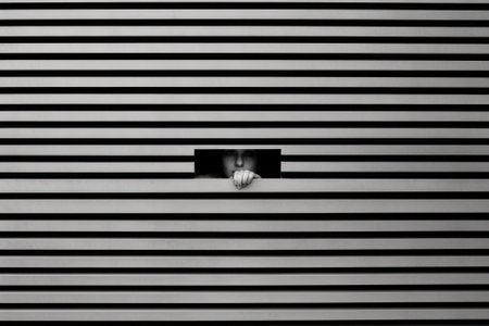 Scary eye peek out of strip lines abstract concept of unhappy vision minimal comelinessの素材