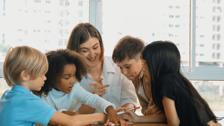 Professional caucasian teacher telling story to diverse student while sitting at table with...
