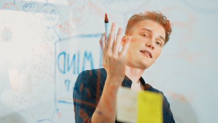 Closeup image of professional caucasian businessman presenting business idea with confident while...